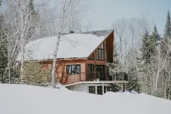 Log house in snow