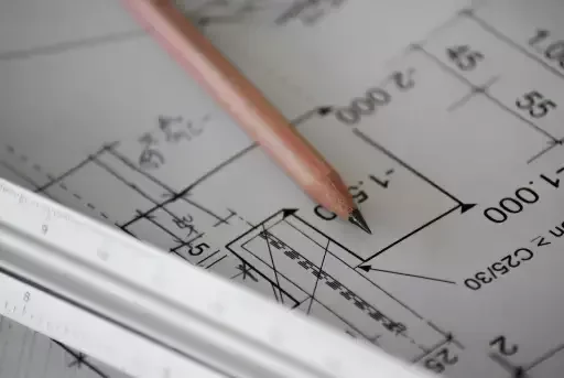 Pencil and Scale Ruler on Blueprint
